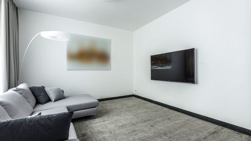 A flat-screen television mounted in a living room