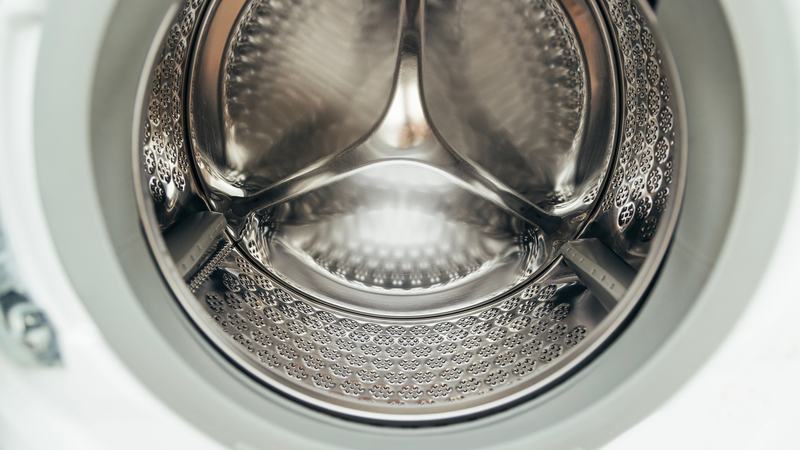 The stainless drum of a modern front-loading washing machine